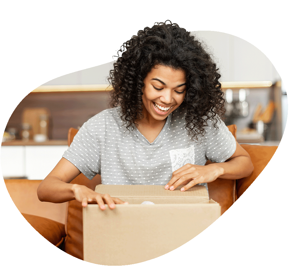 Woman opening up box looking excited