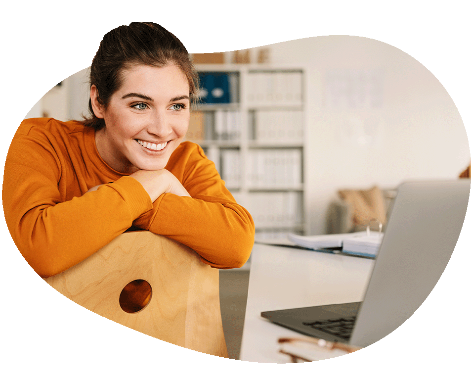 Woman smiling looking at laptop