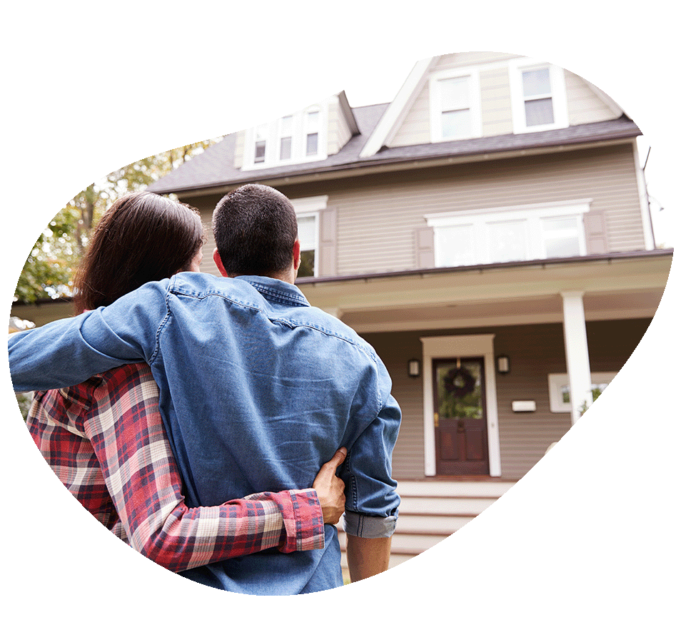 Couple outside looking at house